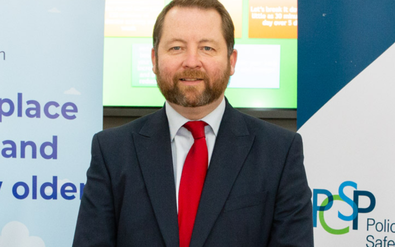 Eddie smiling at the camera at an event